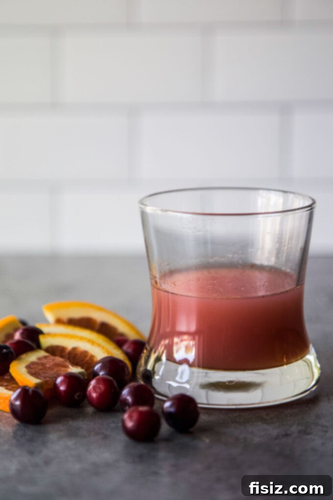 Beat the Bloat: 3 DIY Tonics for Thanksgiving Digestion 6 Ingredients for the Cranberry & Cinnamon Tonic, including cranberry juice, sparkling water, fresh orange juice, cinnamon, and honey.