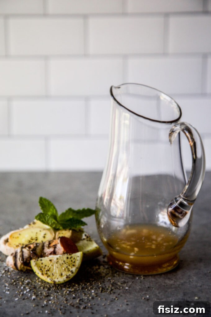 Beat the Bloat: 3 DIY Tonics for Thanksgiving Digestion 8 Ingredients for the Lemon Cider Tonic, featuring lemon, honey, apple cider vinegar, minced ginger, vanilla extract, and ground turmeric.