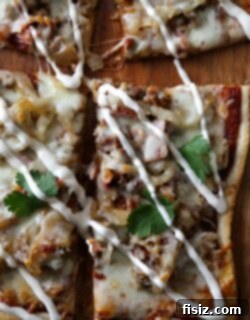 Caramelized Onion BBQ Sausage Ranch Pizza 2 A freshly baked slice of Caramelized Onion, Sausage, and BBQ Pizza with Ranch Dressing