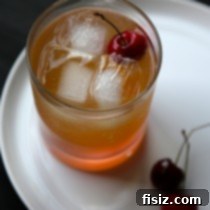 Cherry Ginger Bourbon Fizz cocktail, garnished and ready
