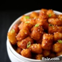 asian barbecue sticky tater tots with toasted sesame seeds