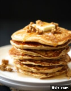Featured image for Apple-Gingersnap Pancakes with Apple Crisp Granola & Maple Syrup recipe.