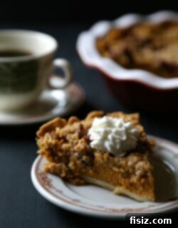Boozy Bourbon Pumpkin Pie with Spiced Pecan Streusel 2 A perfectly baked slice of Bourbon Pumpkin Pie with Cinnamon Pecan Streusel