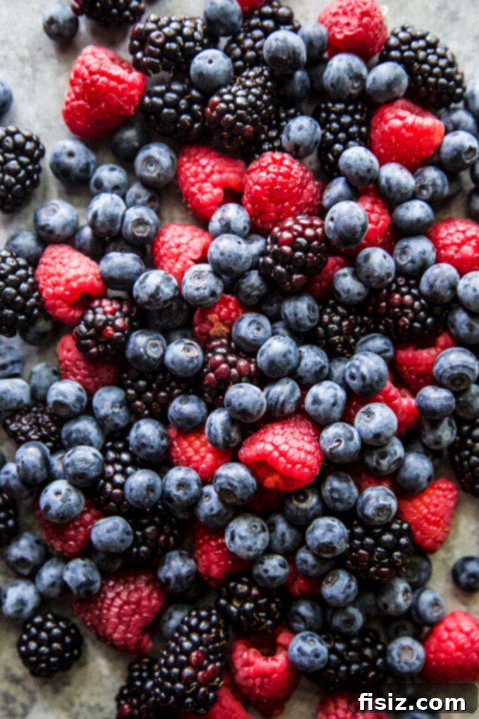 Effortless Berry Ricotta Delight 4 Fresh raspberries, blueberries, and blackberries displayed, ready to be used in Ricotta Cake