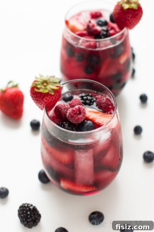 Refreshing Summer Berry Sangria, garnished with fresh berries