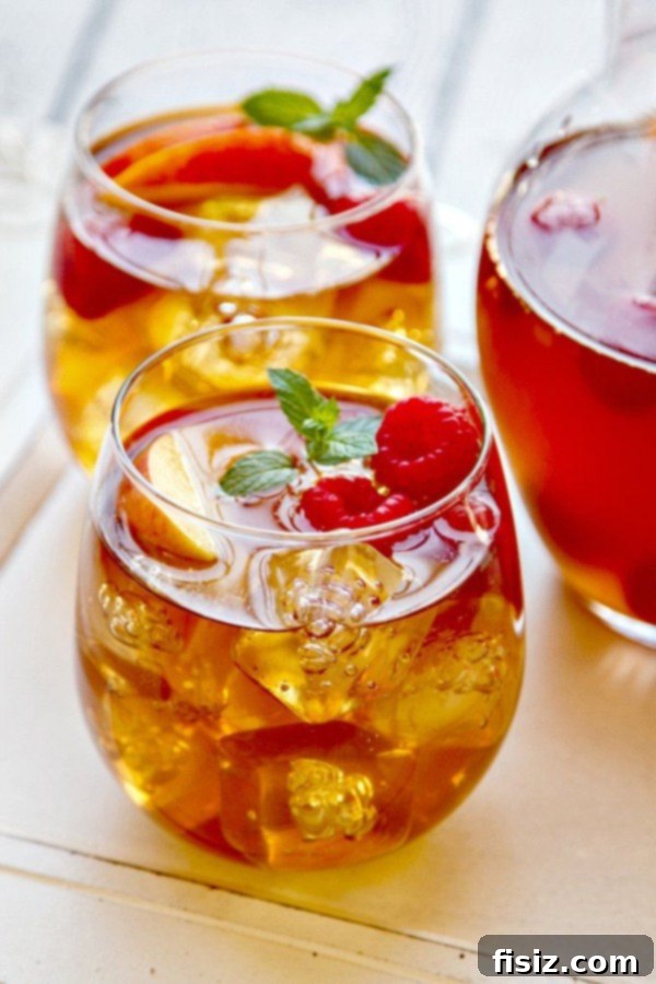 Inventive Sweet Tea Sangria with lemon slices and mint