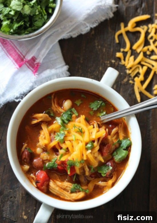 10 Ultimate Tailgate Chili Recipes 9 Bowl of BBQ Chicken Chili with toppings, a tasty fusion recipe.