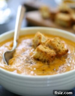 Velvet Ginger Sweet Potato Soup with Crispy Curry Croutons 2 A bowl of Ginger Sweet Potato Soup with Toasted Curry Croutons