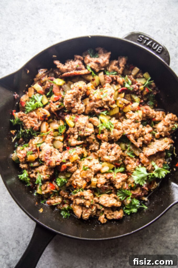Spicy Sausage and Pepper Stuffing 5 Chorizo with spices in a skillet