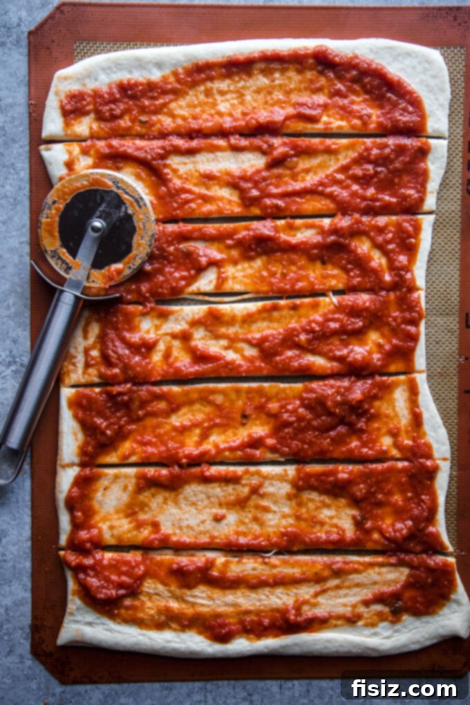 Pizza dough sliced into strips