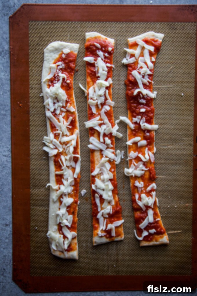 Pizza dough topped with mozzarella
