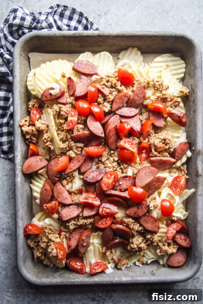Loaded Italian Nacho Tray: Classic Antipasto Chips with Salami & Mozzarella 6 tray with chips, chicken, sausage, and tomatoes
